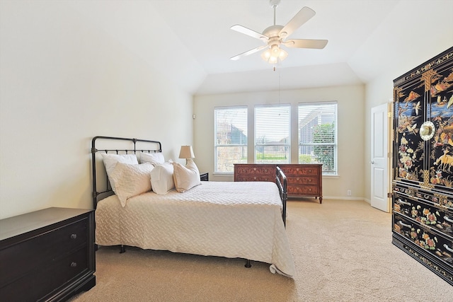 bedroom featuring ceiling fan, light carpet, and lofted ceiling