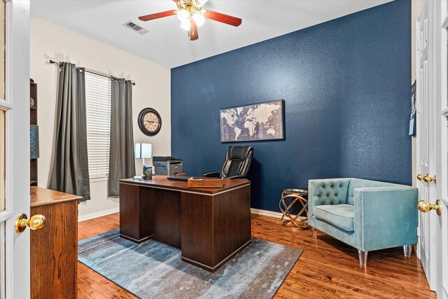 office area with ceiling fan and hardwood / wood-style flooring