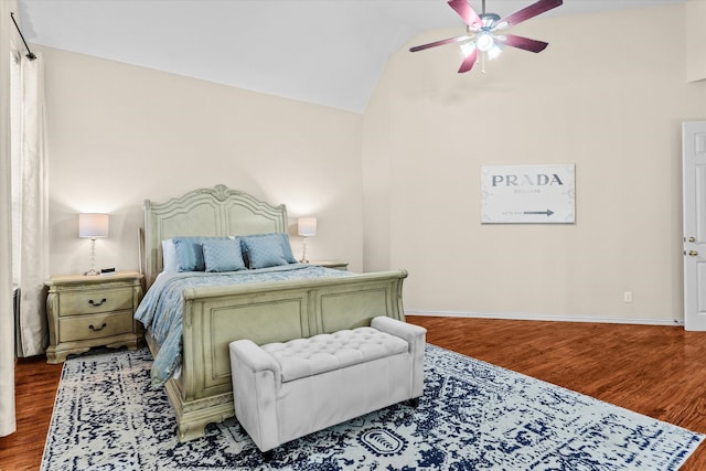 bedroom with ceiling fan, wood-type flooring, and lofted ceiling