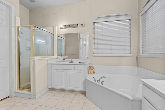 bathroom with tile patterned floors, independent shower and bath, and vanity