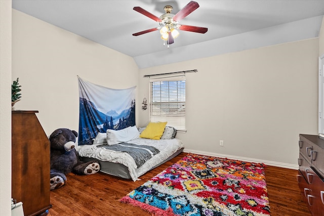 bedroom featuring ceiling fan, vaulted ceiling, and hardwood / wood-style flooring