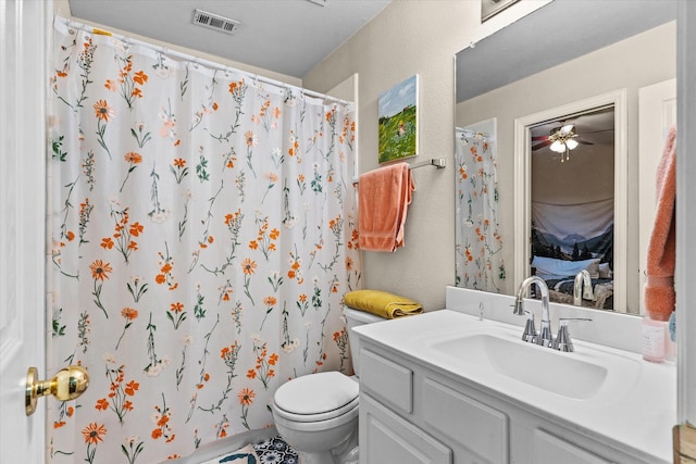 full bathroom with visible vents, a textured wall, toilet, ensuite bath, and vanity