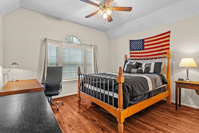 bedroom featuring ceiling fan, hardwood / wood-style flooring, and lofted ceiling