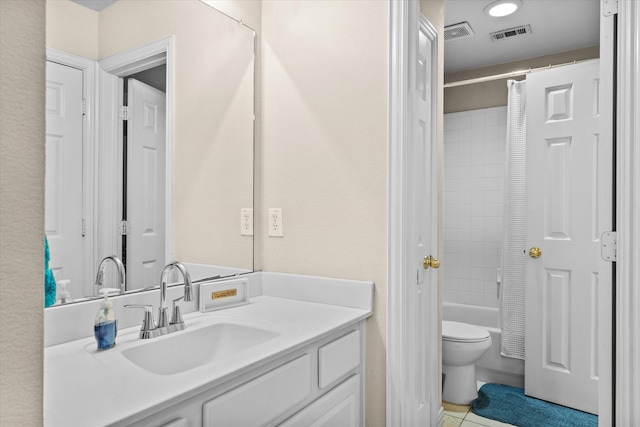 full bathroom featuring tile patterned flooring, vanity, shower / tub combo, and toilet