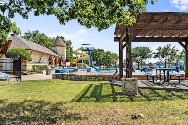 exterior space featuring a community pool and a pergola