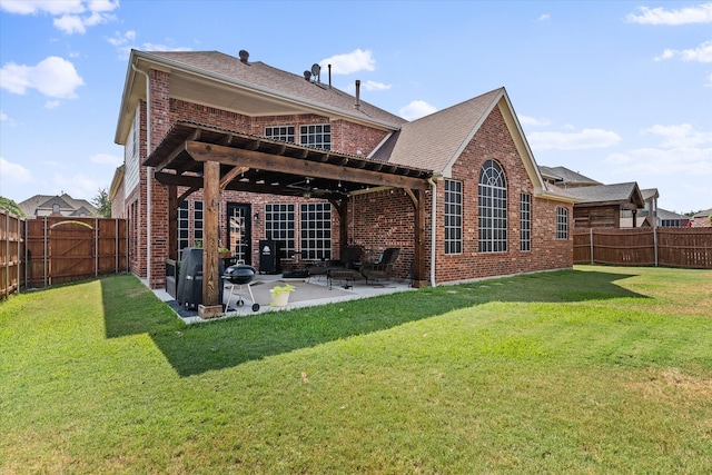 back of property with a lawn, a pergola, and a patio