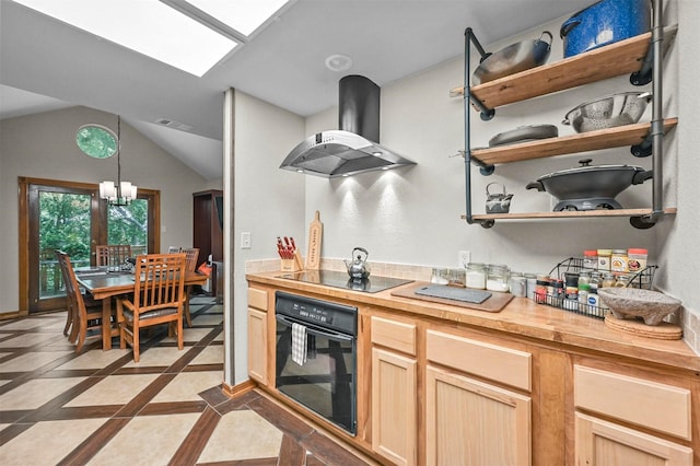 kitchen featuring extractor fan, wooden counters, black appliances, light brown cabinetry, and hanging light fixtures