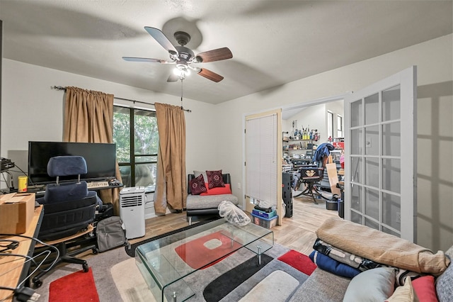 home office with ceiling fan and hardwood / wood-style floors