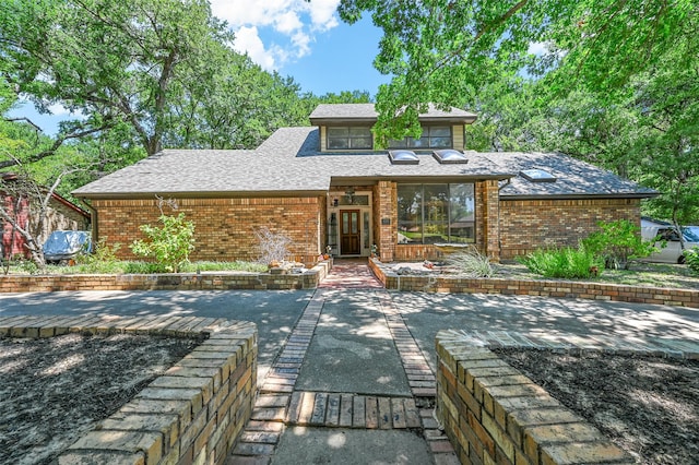 rear view of house with a patio