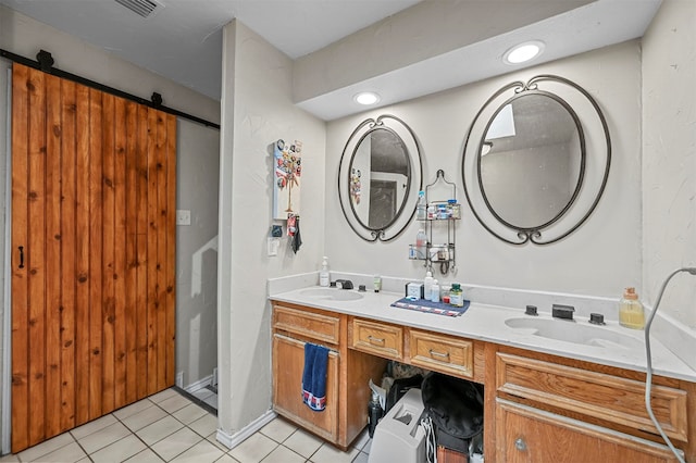 bathroom with dual vanity and tile patterned floors