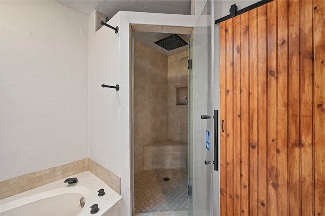 bathroom with shower with separate bathtub