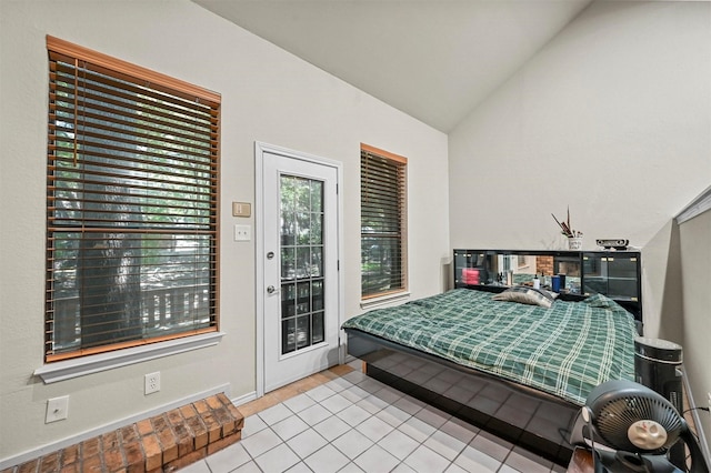 bedroom featuring vaulted ceiling and access to exterior