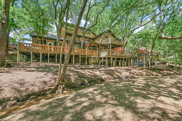 back of house featuring a wooden deck