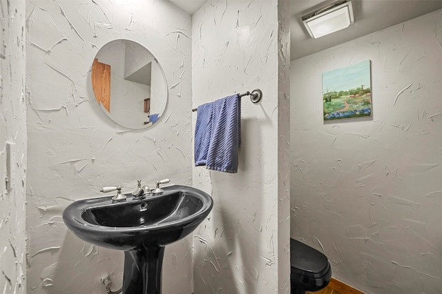 bathroom featuring toilet