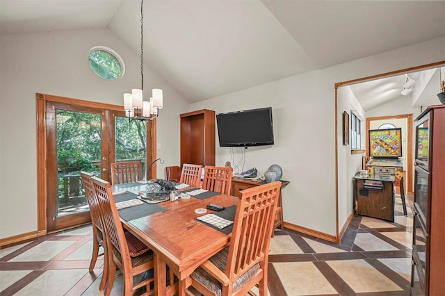 dining space featuring a chandelier and vaulted ceiling