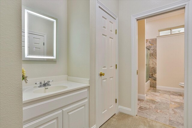 full bathroom featuring tile patterned flooring, toilet, tub / shower combination, and vanity