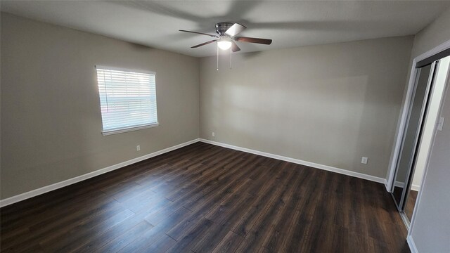 spare room with hardwood / wood-style floors and ceiling fan