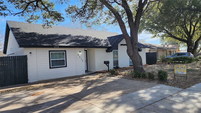 single story home featuring a patio