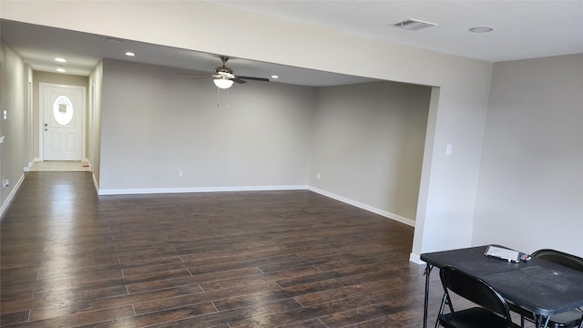 interior space featuring ceiling fan and dark hardwood / wood-style flooring