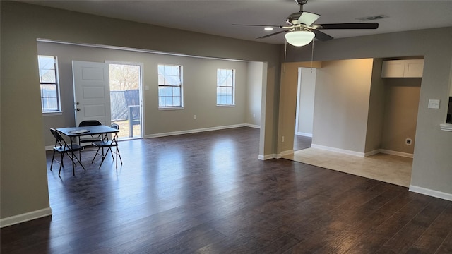 interior space with dark hardwood / wood-style floors and ceiling fan