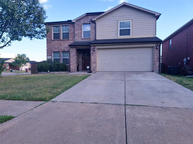 front facade with a garage and a front yard