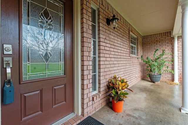 doorway to property with covered porch