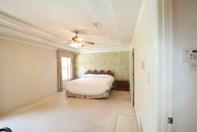 carpeted bedroom featuring a textured ceiling, a raised ceiling, and ceiling fan