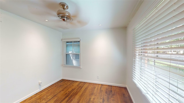 unfurnished room with ceiling fan, wood-type flooring, and plenty of natural light