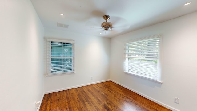 spare room with ceiling fan and hardwood / wood-style floors