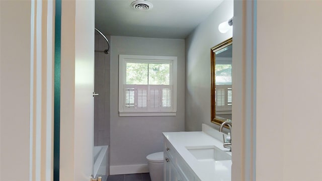 full bathroom featuring tile patterned flooring, toilet, vanity, and shower / tub combination