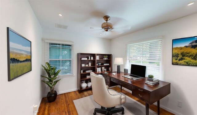 office space with ceiling fan and wood-type flooring