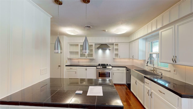 kitchen featuring white cabinetry, dark hardwood / wood-style floors, sink, wall chimney range hood, and stove