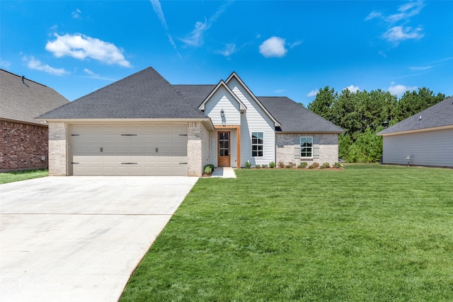 view of front of home featuring a front yard and a garage