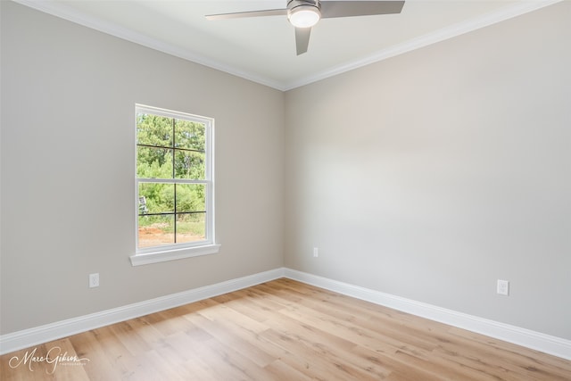 spare room featuring light wood-type flooring, ornamental molding, ceiling fan, and a healthy amount of sunlight