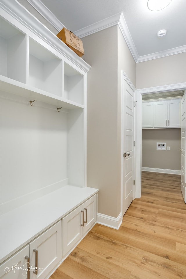 mudroom featuring light hardwood / wood-style flooring and crown molding