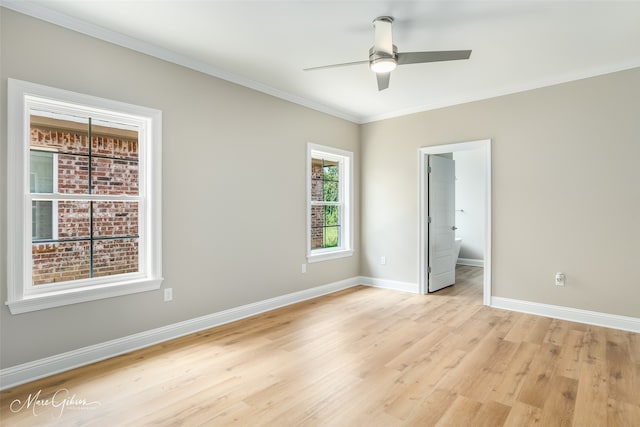 unfurnished bedroom featuring ensuite bath, ceiling fan, ornamental molding, and light wood-type flooring