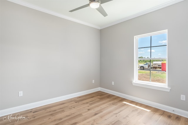 empty room with ceiling fan, light hardwood / wood-style flooring, and crown molding