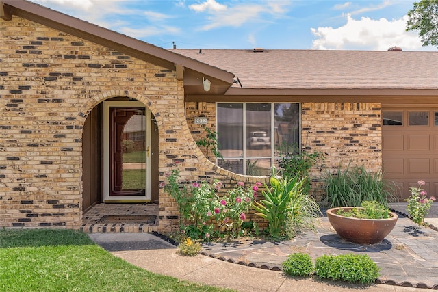 entrance to property featuring a garage