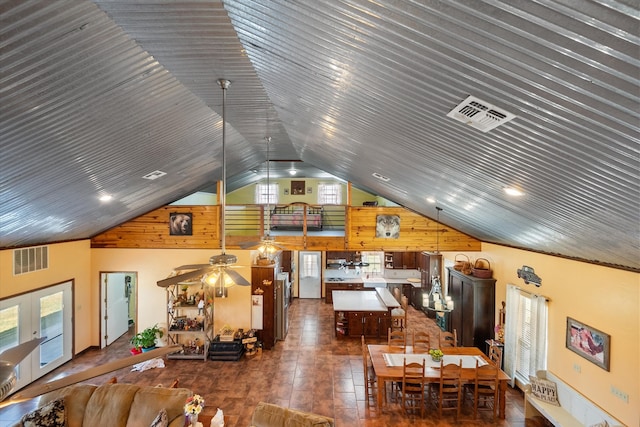 living room with ceiling fan, lofted ceiling, and dark hardwood / wood-style floors