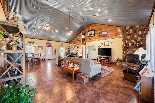 living room with high vaulted ceiling, ceiling fan, wooden ceiling, and a fireplace