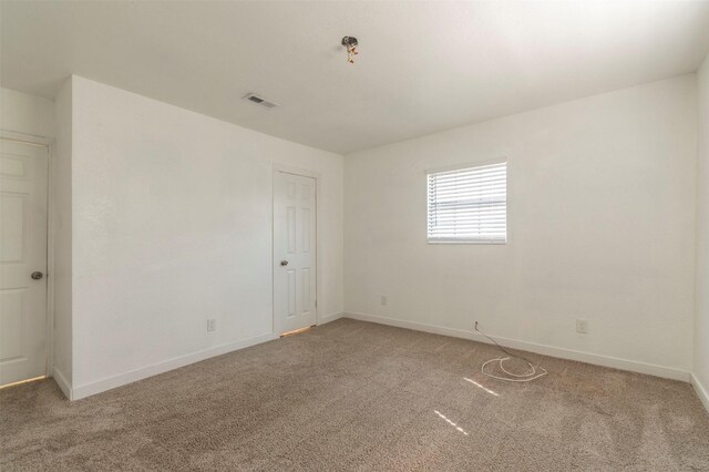 unfurnished room featuring carpet floors