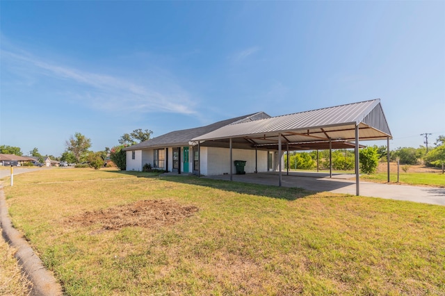 exterior space with a front lawn and a carport