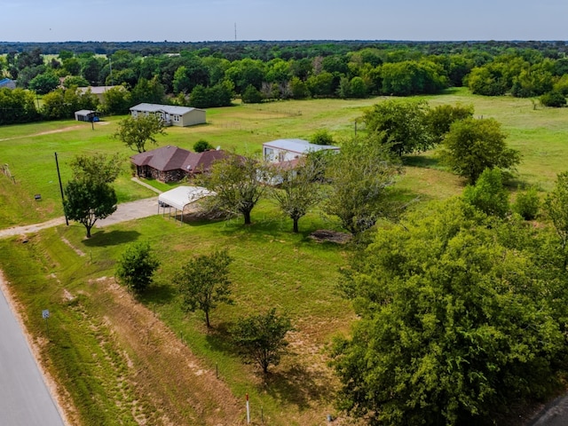 bird's eye view featuring a rural view and a wooded view