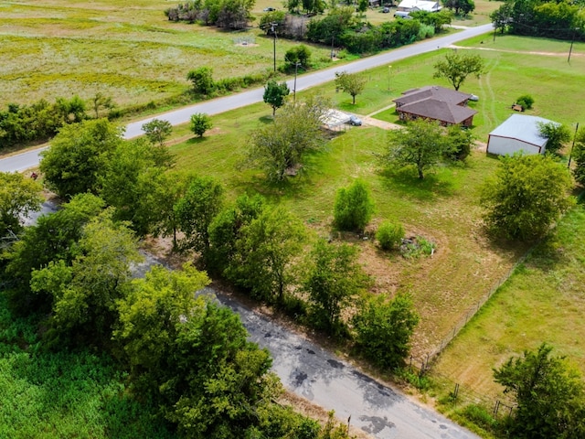 birds eye view of property featuring a rural view