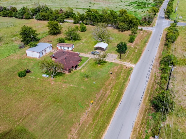 birds eye view of property featuring a rural view