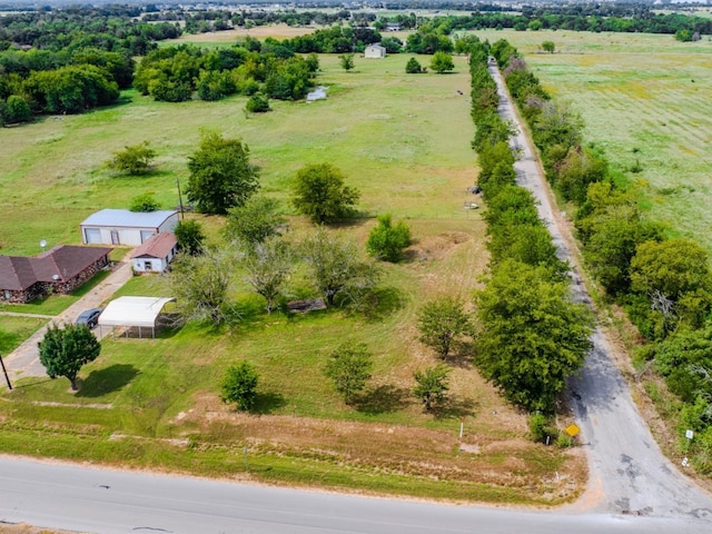 birds eye view of property featuring a rural view