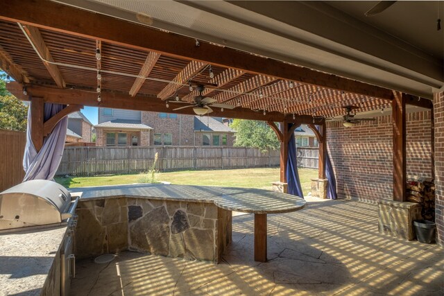 view of patio featuring ceiling fan