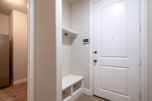 mudroom with light tile patterned flooring