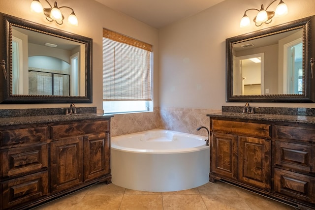 bathroom featuring separate shower and tub, tile patterned flooring, and vanity