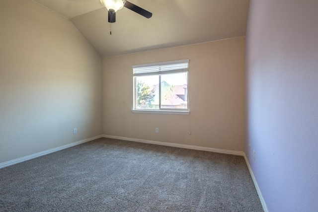 carpeted spare room with lofted ceiling and ceiling fan